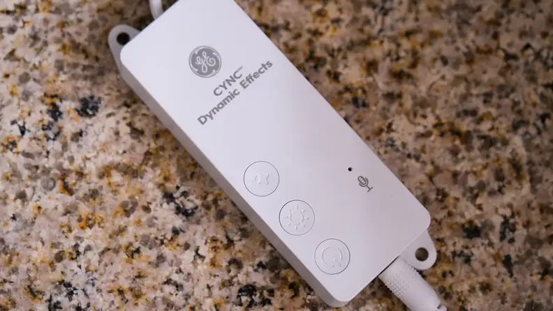 The GE Cync remote control sits on a counter.
