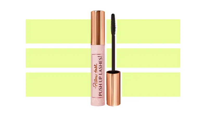Charlotte Tilbury Pillow Talk Push Up Lashes Volumizing & Lengthening Mascara against a green and white background.