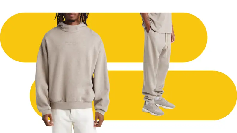 A model wearing an oatmeal colored hoodie and another wearing matching sweatpants.