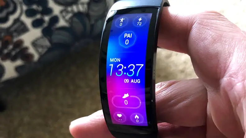 The all-black Amazfit X is shown on a wrist with vivid color across its curved OLED display.