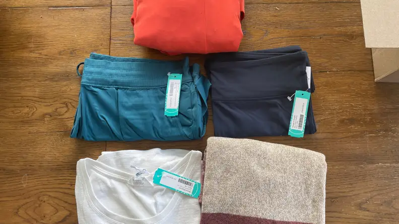 A collection of folded shirts by Stitch Fix.