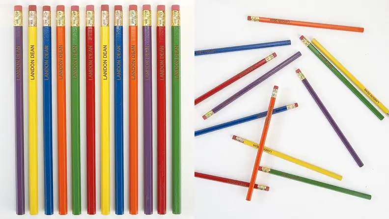 On left, multi-colored pencils that have the name "Landon Dean" engraved in them lined up. On right, multi-colored pencils with the name "Landon Dean" engraved on them, scattered around.
