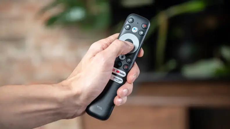 A close-up of the remote control that ships with the TCL 5-Series with Google TV