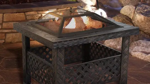 Iron fire pit with flames blazing