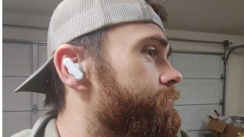 Close-up of the author's face sporting the earbuds.
