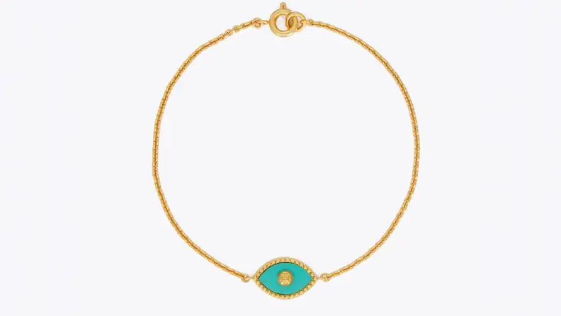 Gold bracelet with aqua-colored eye charm