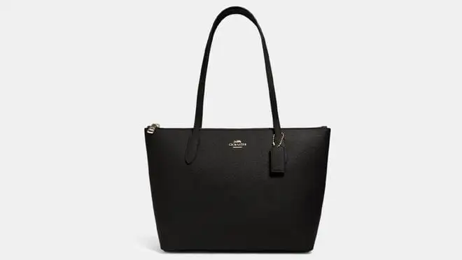 A black Coach shoulder bag.