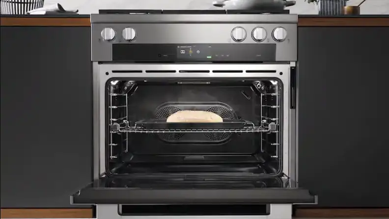 A range sits in cabinetry in a kitchen setting