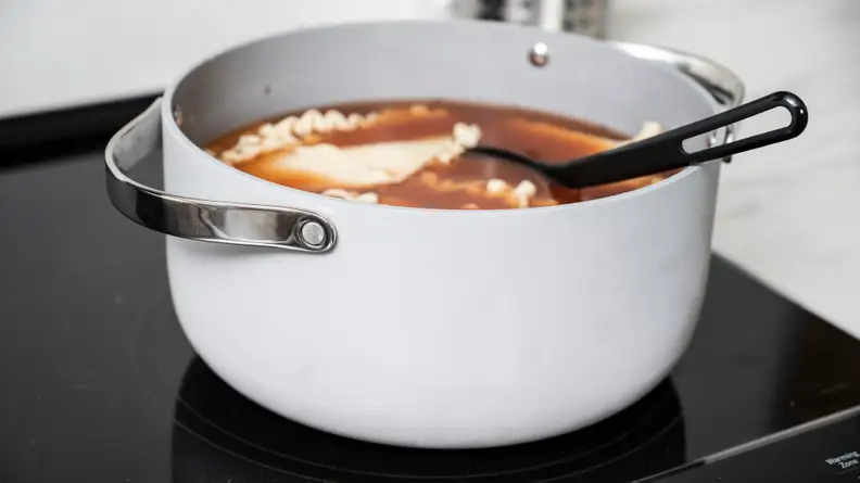 The rivets on the stock pot mean handles there's a slight chance the handles could come off.