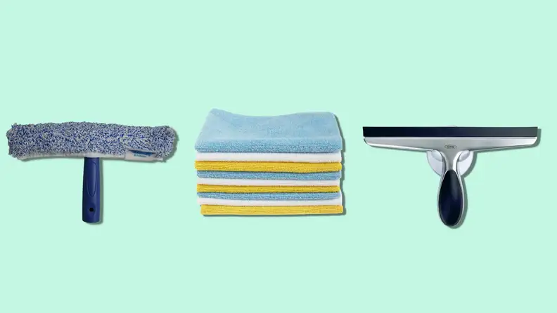 A scrubber brush, squeegee, and pack of microfiber cloths on a mint green background.