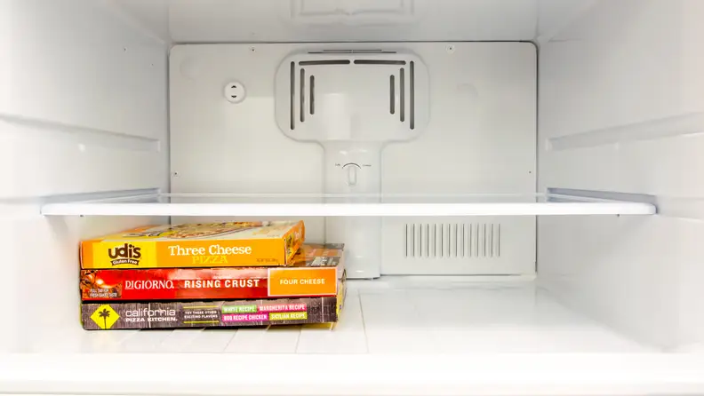 The freezer compartment of a GE top freezer refrigerator