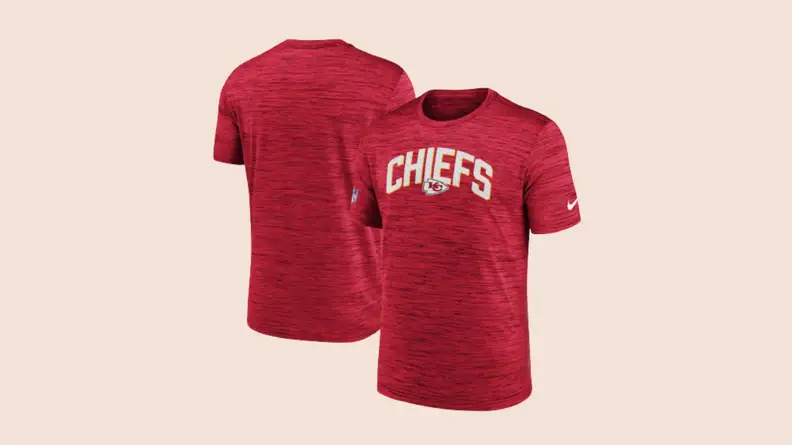 Front and back of red Kansas City Chiefs shirt against beige background