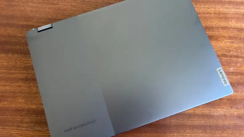 The laptop closed on top of a table.