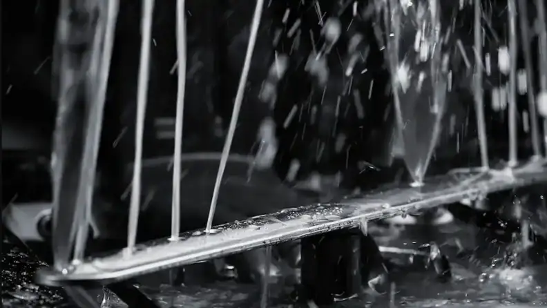A spray arm shoots water