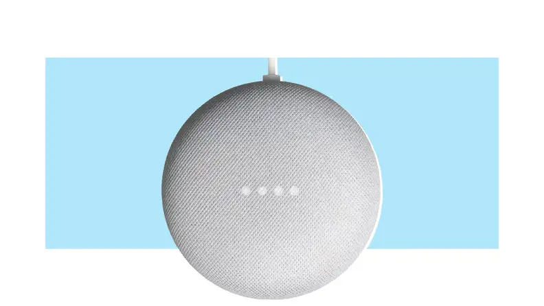 A Google Nest Mini smart speaker on a colorful background