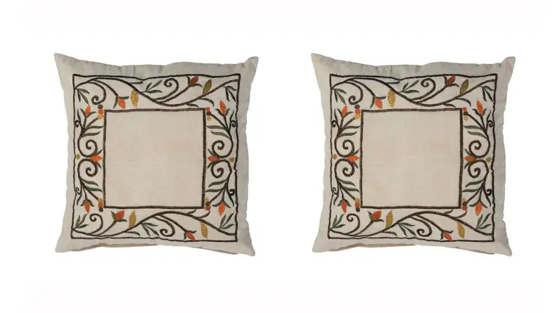 Two images of the same pillow embroidered with a pattern of ivy and leaves.