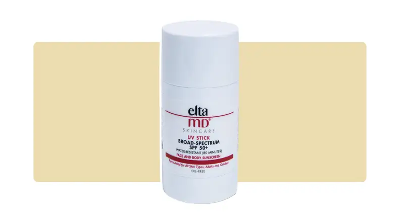 EltaMD sunscreen stick infront of a yellow background.