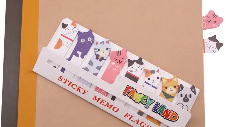 These sticky notes feature little kitty heads that pop out between pages.