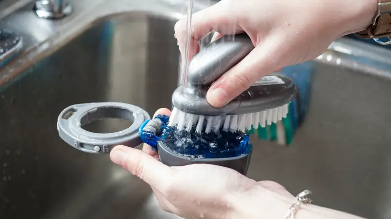 Scrub the top of your reusable water bottle