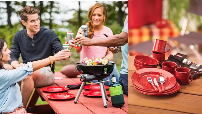 A group of friends enjoying a picnic using red enamel plates.