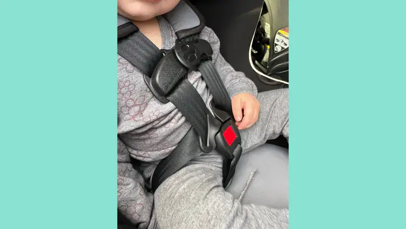 A child buckled into the Graco Extend2Fit 3-In-1 car seat.