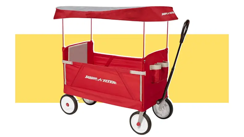 A red Radio Flyer outdoor wagon on a yellow background.