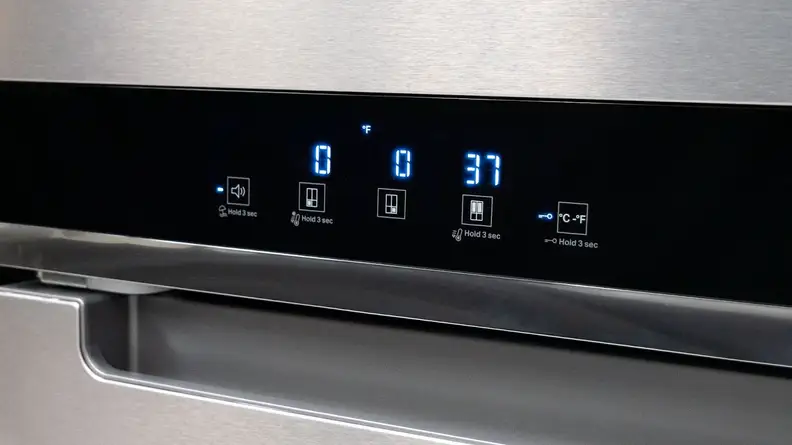 A close-up of the fridge's control panel, showing the temperature settings for its two freezer compartments as well as its main fridge compartment.