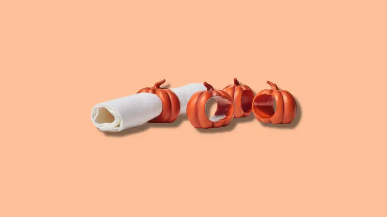 Small orange pumpkin-shaped cloth napkin holders.