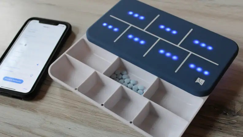 The lid has lights that indicate how many of each pill you need to take.