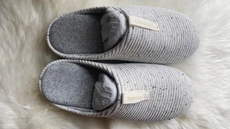 A pair of gray slippers.