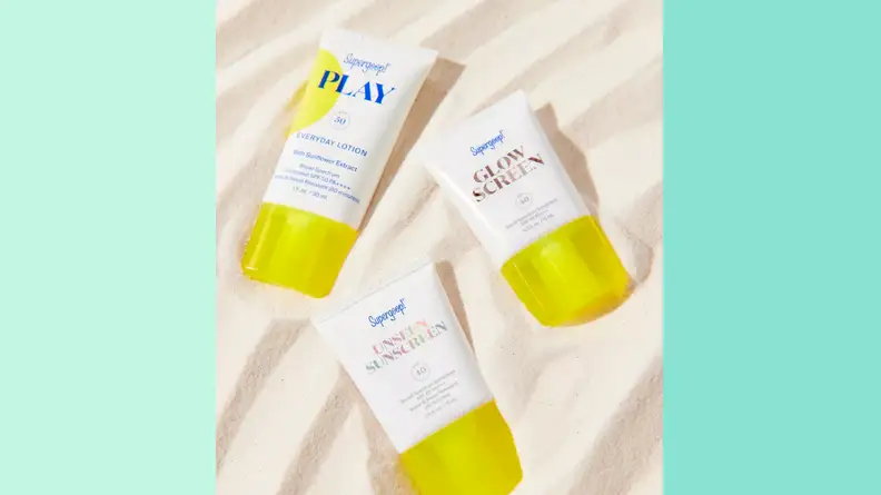 An image of three individual small bottles of Goop sunscreen, including the Unseen sunscreen, the Play lotion, and the Glow Screen sunscreen.