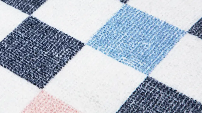Close-up of the squared pattern of the mat.