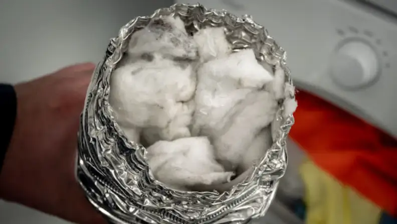 A dryer duct clogged with lint.