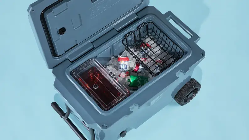 A rolling Brumate cooler sits on a blue background.