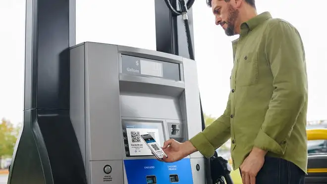 man using atm machine