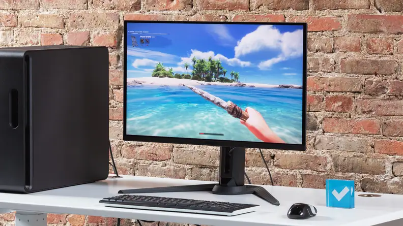 The Gigabyte AORUS FO27Q3 displaying a man on the beach in the water