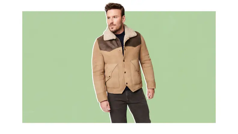 A model wearing a western style shearling jacket.