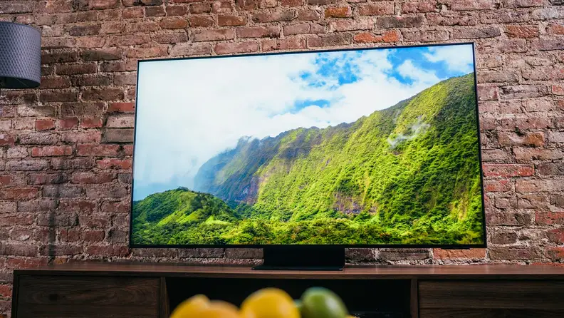 Flatscreen TV against a brick wall