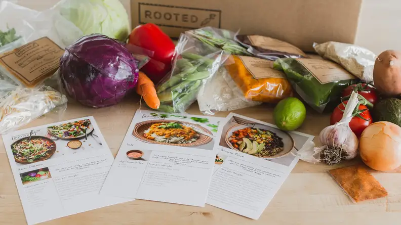 The Rooted meal kit contents laid out on a table.