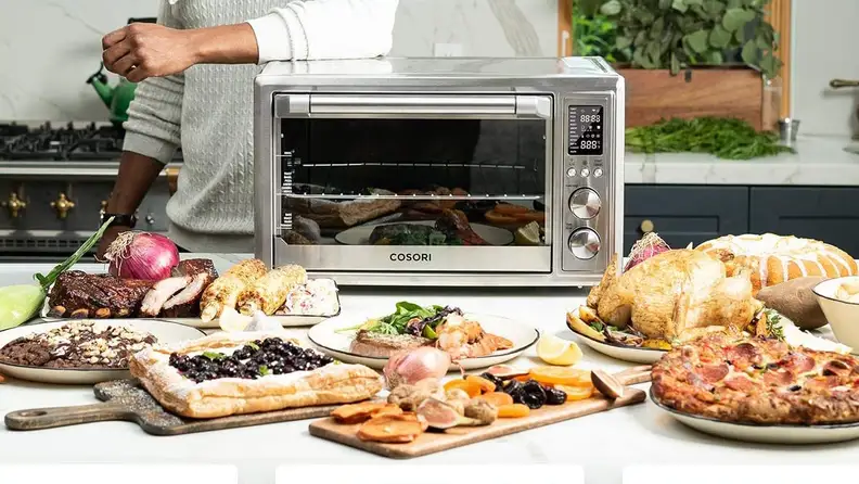 a spread of food outside of a toaster oven.
