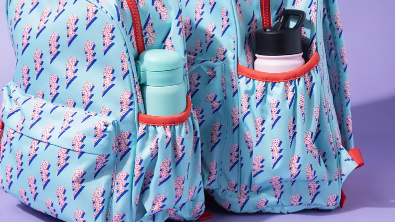 A side shot of bottles in a Crate & Barrel Kids' backpack