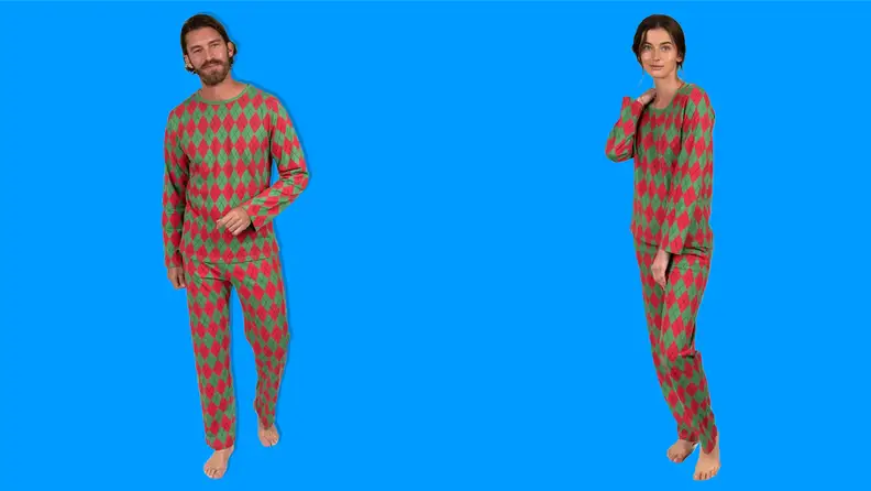 A man and a woman wearing the Leveret Two-Piece Cotton Argyle Christmas Pajamas on a blue background.