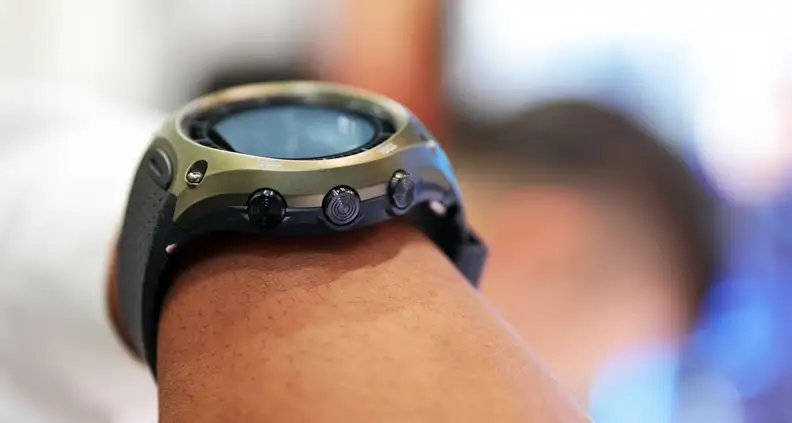 The right side of the watch has three physical buttons, two of which are labeled TOOL and APP.
