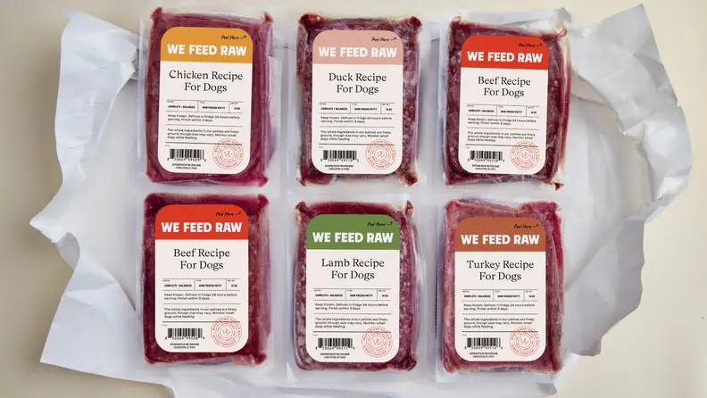 6 containers of raw food in a box