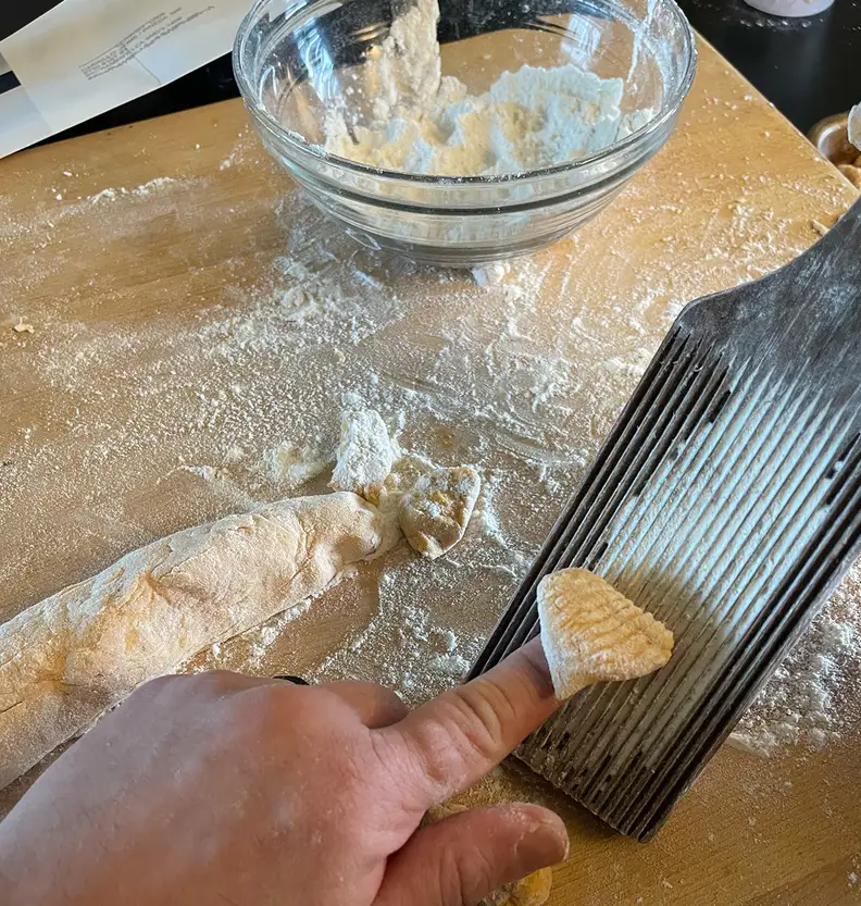 Rolling gnocchi on a paddle