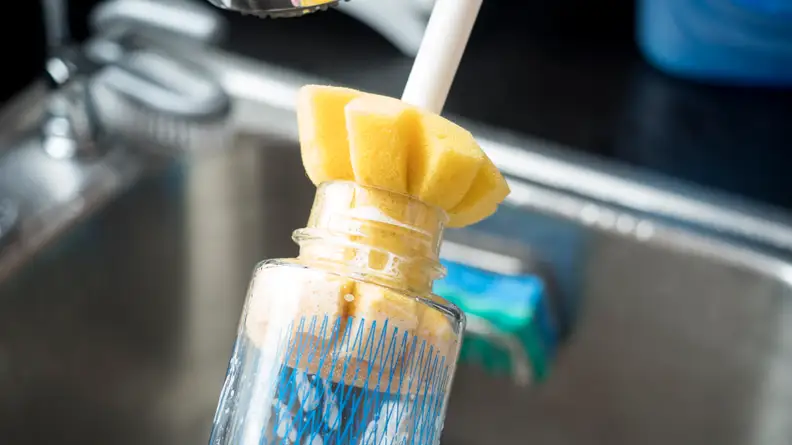 Scrub the inside of the neck of your reusable water bottle