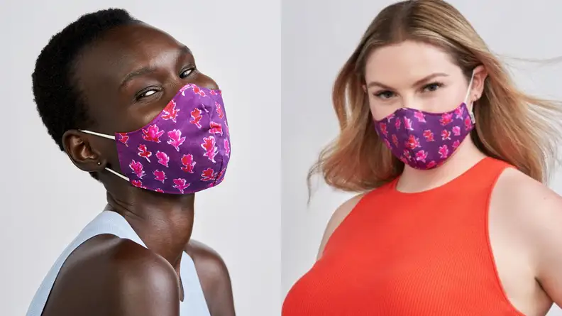 A couple models sport the Impower by Prabal Gurung reversible face mask, which has a purple-and-pink design.