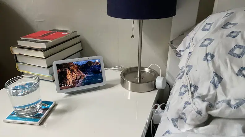 the nest hub on a bedside table