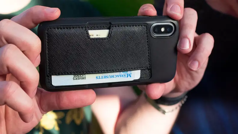 A person takes a photo with a cell phone.