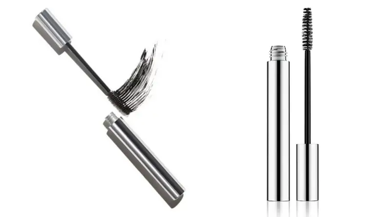 On the left: The silver tube of the Clinique Naturally Glossy Mascara lays on a white background with the wand outside of the cylindrical tube swatching the mascara. On the right: The same tube of mascara stands up with the wand standing next to the tube.